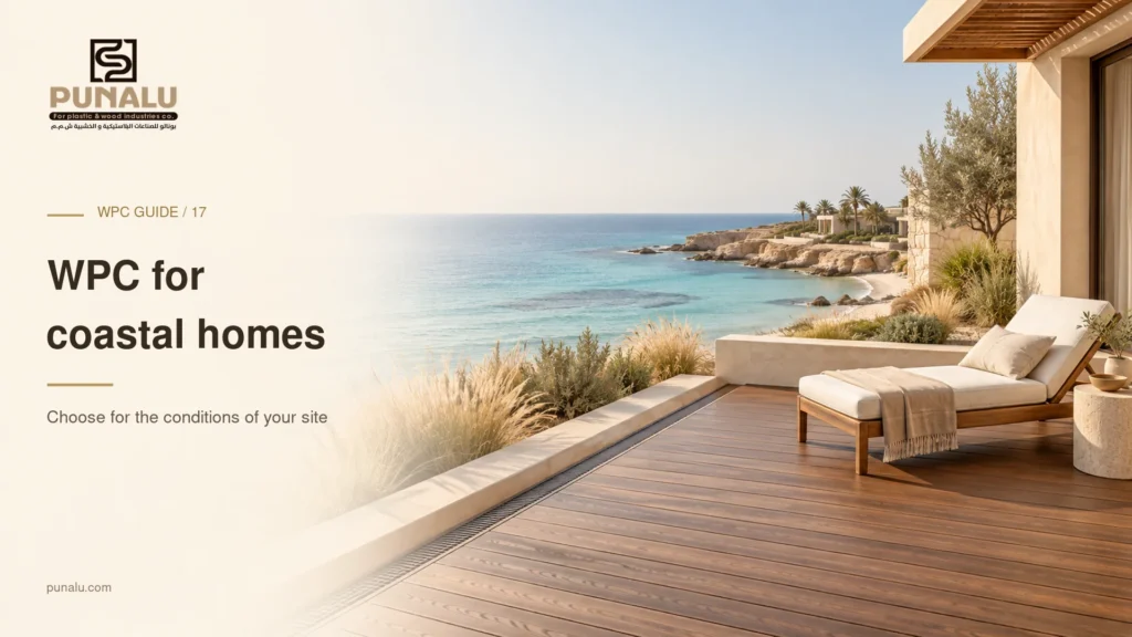 Conceptual coastal home terrace with walnut composite decking, a lounge chair and a sea view.